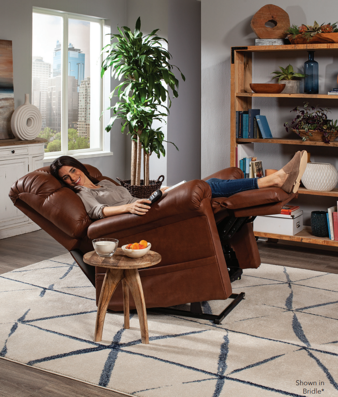 Woman reclining in her brown leather Cloud with Twilight Golden Technologies lift chair